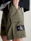 Green Calvin Klein Essentials. Timeless staples perfected for the modern wardrobe, evolving every season with new shapes and colours. These shorts are created with 20% recycled cotton, created by reprocessing existing materials.  Men