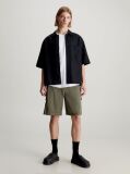 Green Calvin Klein Essentials. Timeless staples perfected for the modern wardrobe, evolving every season with new shapes and colours. These shorts are created with 20% recycled cotton, created by reprocessing existing materials.  Men