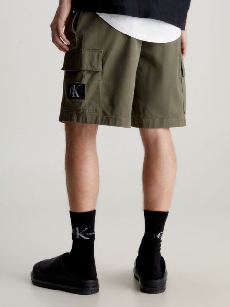 Green Calvin Klein Essentials. Timeless staples perfected for the modern wardrobe, evolving every season with new shapes and colours. These shorts are created with 20% recycled cotton, created by reprocessing existing materials.  Men
